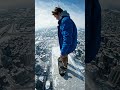 Skateboarder on skyscraper rooftop #adventure