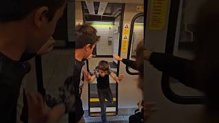Kid barely makes it back to the Underground train in London with Mom screaming at him.