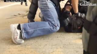 Slow motion of bloody arrest by undercover police in Hong Kong