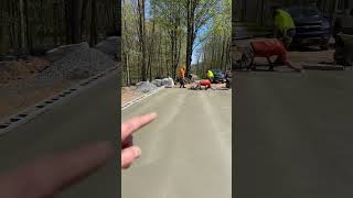 Hand finishing a garage floor.