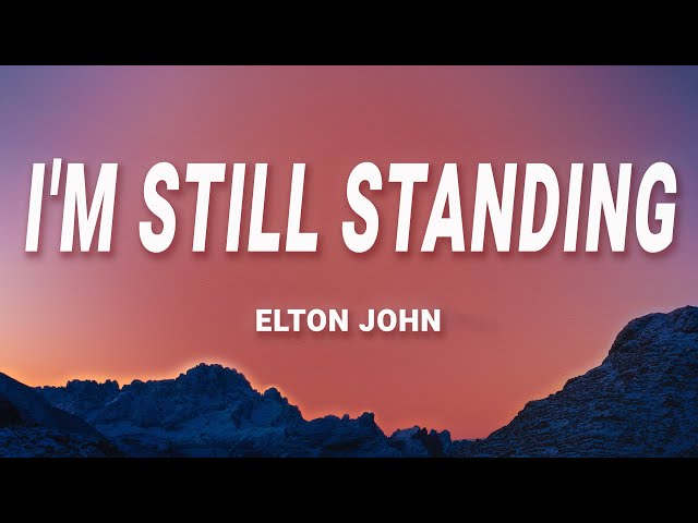 Elton John - I'm Still Standing (Lyrics) class=