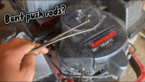 What can cause bent push rods on a lawnmower?