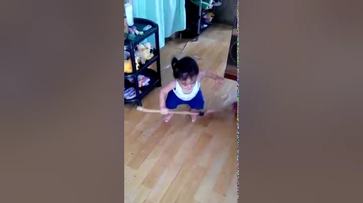 Chad McLane @ 11mos old sweepting the floor.