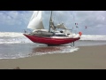 Abandoned boat reach seashore in Viareggio - Italy 27.04.2016