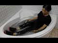 Wetlook - An in bathtub in black clothes and wet hair