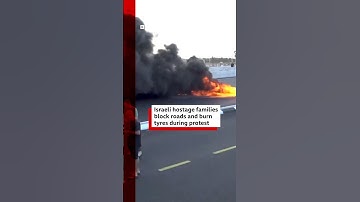 Families of Israeli hostages held by Hamas in Gaza block roads and burn tyres in protest. #BBCNews