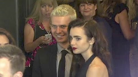 LILY COLLINS brings secret date to GO Campaign gala