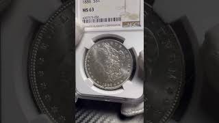 Серебряный доллар США 1886 года.(Morgan Dollar). Слаб NGC MA63. Леди Либерти.