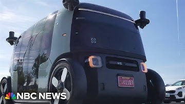 Auto industry embraces driverless future with robotaxis