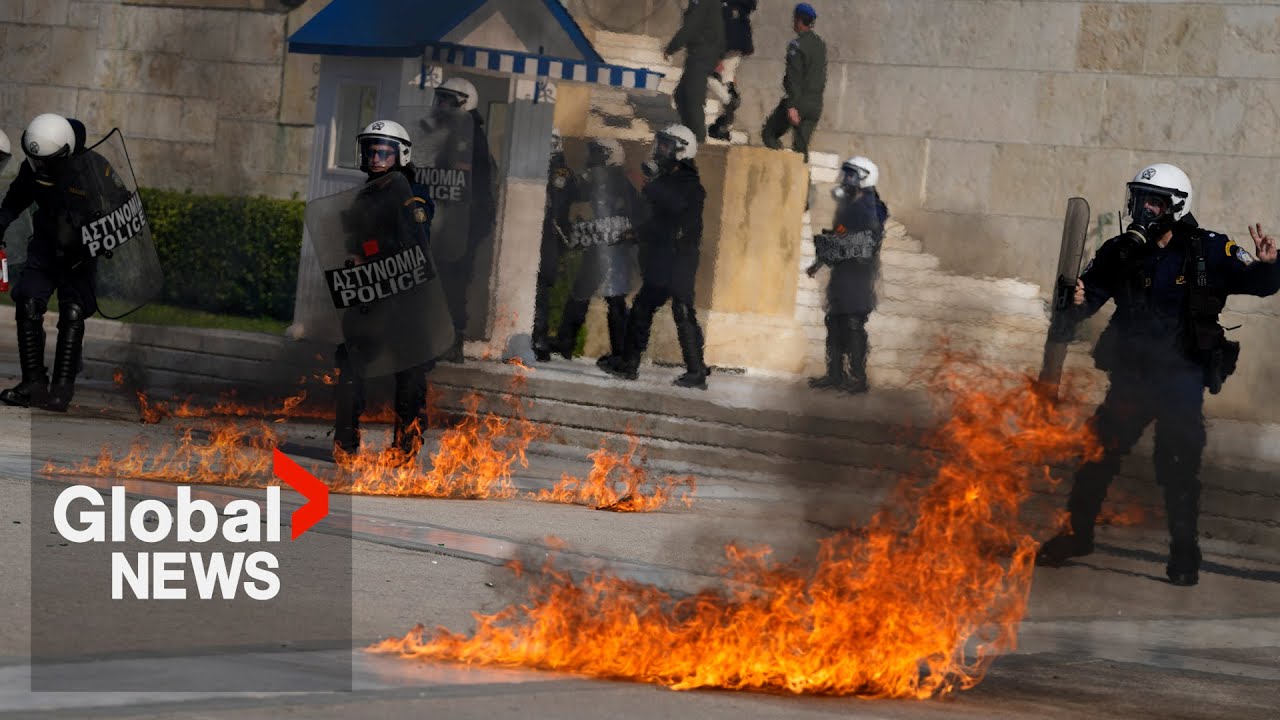 Greece protests: Petrol bombs hurled at police during workers' rally in Athens