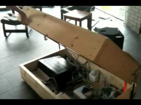 media center in a coffee table.. in action. (concealed tv media center in a coffee table.. in action. (concealed tv