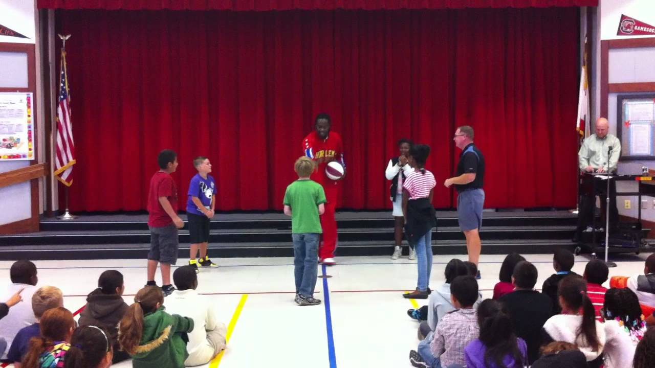 Harlem Globetrotter Slick Willie Shaw visits Isabelle Jackson