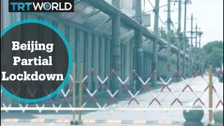 Beijing placed under partial lockdown to halt outbreak