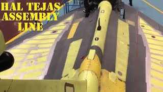 Rare video of  LCA Tejas MK1 SP-11 being given final touches before first flight. HAL Assembly Line.