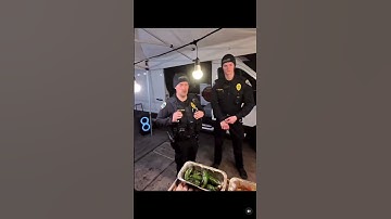 Thumbnail of Man Selling Hotdogs On street to Police officers #hotdog #police #streetfood
