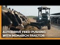 Autonomous dairy feed pushing with an electric tractor