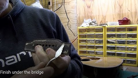 Removing the finish under the bridge on a Martin guitar