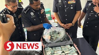 Cops: Please take back your suitcase filled with RM500,000 cash