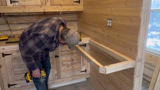 Finishing the cabinets in the kitchen at the off grid log cabin, woodwork, wilderness, survival.