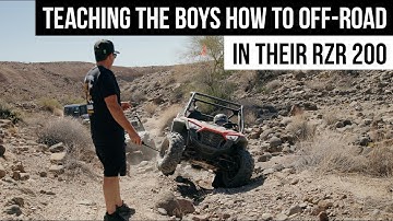 TEACHING THE BOYS HOW TO OFF-ROAD IN THEIR RZR 200 | CASEY CURRIE VLOG