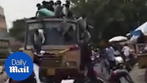 Group of students suffer heavy fall after dropping from bus roof