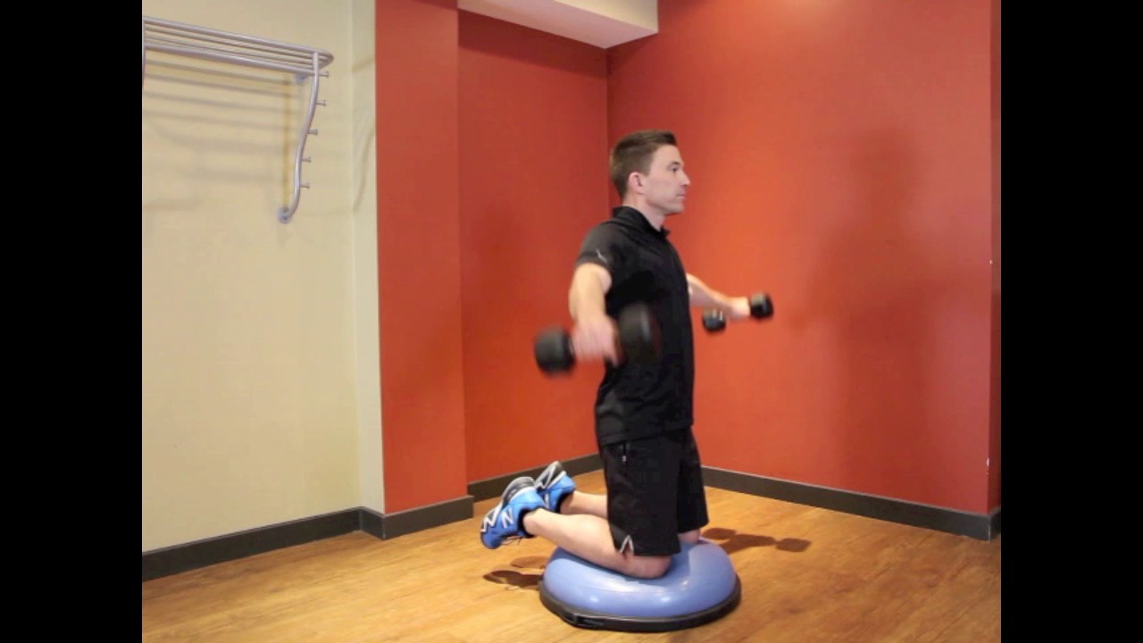 shoulder raise kneeling on BOSU ball with dumbbells - YouTube