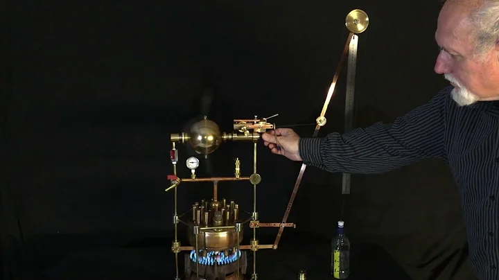 Hero's steam engine lifting a weight to measure power and efficiency of this Greek aeolipile engine