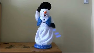 Musical Snowflake Spinning Animated Snowman
