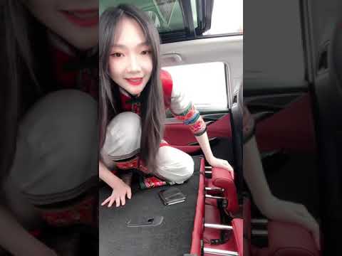 Chinese girl show her black nylon feet in car