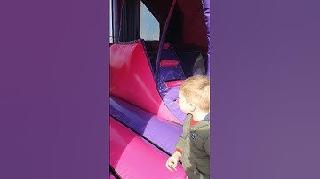 Unicorn bouncy castle with slide