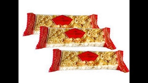 Giới thiệu máy đóng gói kẹo lạc có cấp liệu tự động