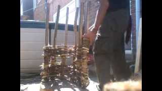 Wood smoker coppice products using hazel rods to weave the story telling chair for our latest woodland class room.