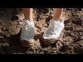 Muddy white sneakers in the forest sneakers muddy abused sneakers sneakers in deep mud  837