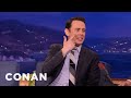 George Clooney Cut Off Colin Hanks On The Red Carpet | CONAN on TBS