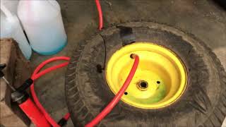 Liquid filling garden tractor tires for more traction.