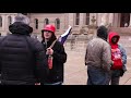 Armed protesters and Trump supporters gather outside Michigan Capitol | AFP