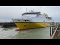 Huge passenger car ferry sailing backwards through narrow canal