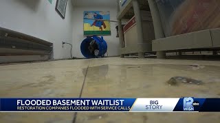 Record rainfall causing record flood damage in homes, businesses