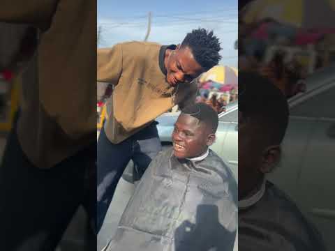 He's cutting hair in the middle of the road for free because he want to meet DAVIDO