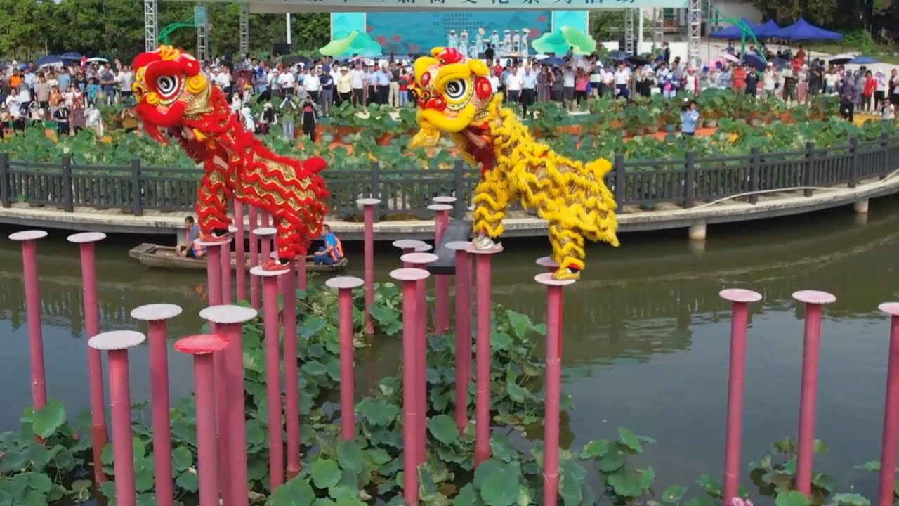 Poles and precision: Chinese lion dancers perform above water Poles and precision: Chinese lion dancers perform above water