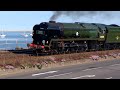 Steam Train.  Loco 35028 'Clan Line' at speed at Starcross passing a Voyager.