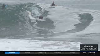 Thumbnail Onlookers gather at The Wedge in Newport Beach as high-powered swells hit SoCal