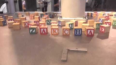 A robot spells my name in blocks