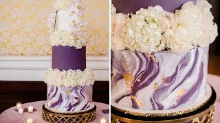 Wedding cake marble and magic, a design with beautiful stone in mind.
marbleized gold leaf fondant brilliant white fresh flowers between...