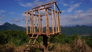 Building a Wooden Shelter on a High Mountain with a Beautiful View of Flying Clouds