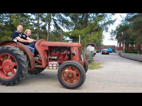 Two friends driving together in a David Brown Cropmaster tractor