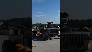 Hot Rod restomod Jeep "Rat Patrol" twin turbo V8 blows by me during Cruisin the Coast car show week
