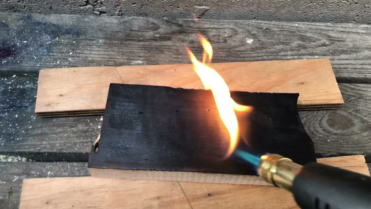 Propane Torch To Shou-sugi-ban Wood Burn a Project Stock Photo