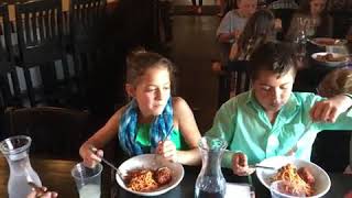 Fifth graders Izzy Powell and Emilio Lucero demonstrate the polite way to eat pasta at Mambo ...