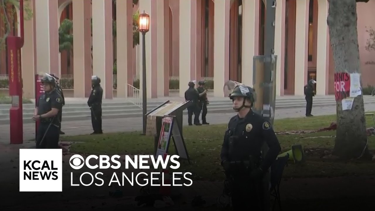 LAPD officers in riot gear clear pro-Palestine encampment at USC - YouTube